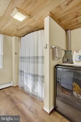 an aerial view of a house with outdoor space lake view and mountain view