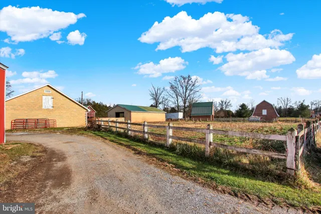 an aerial view of houses with yard