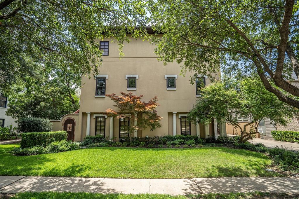4323 Gilbert Avenue, Unit 4 Dallas, TX 75219 - Photo 1 of 40 a front view of a house with a garden
