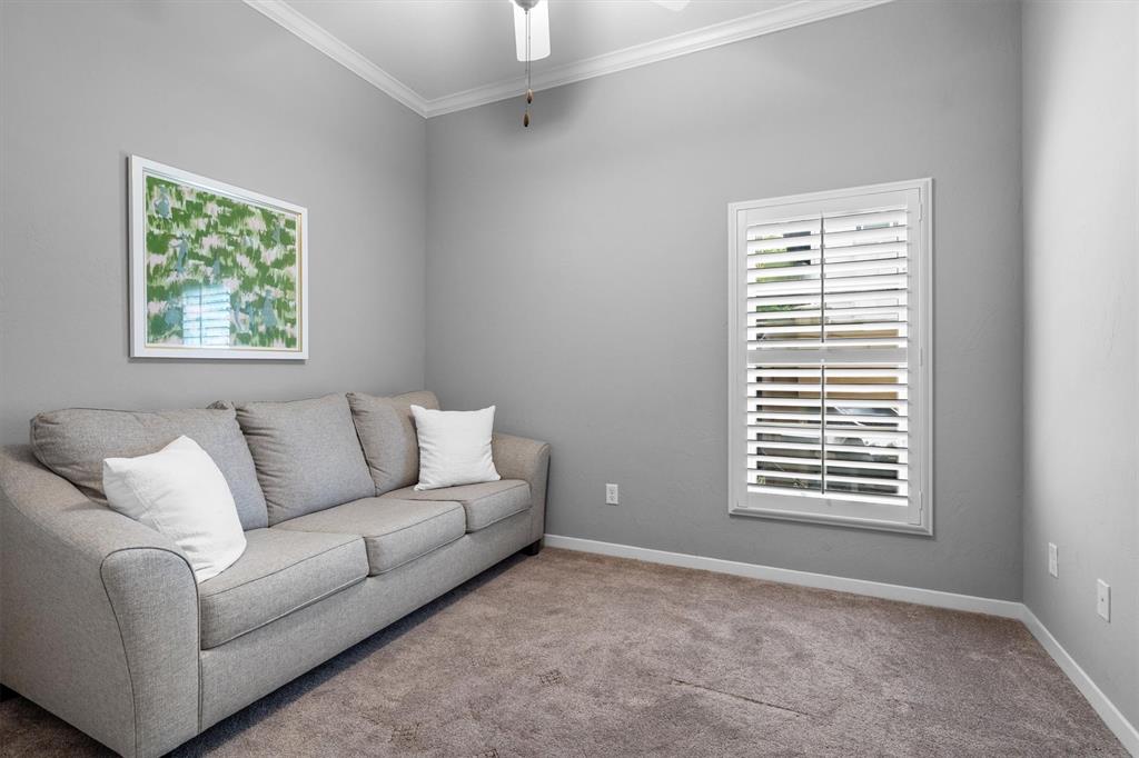 4323 Gilbert Avenue, Unit 4 Dallas, TX 75219 - Photo 11 of 40 a living room with furniture and a window