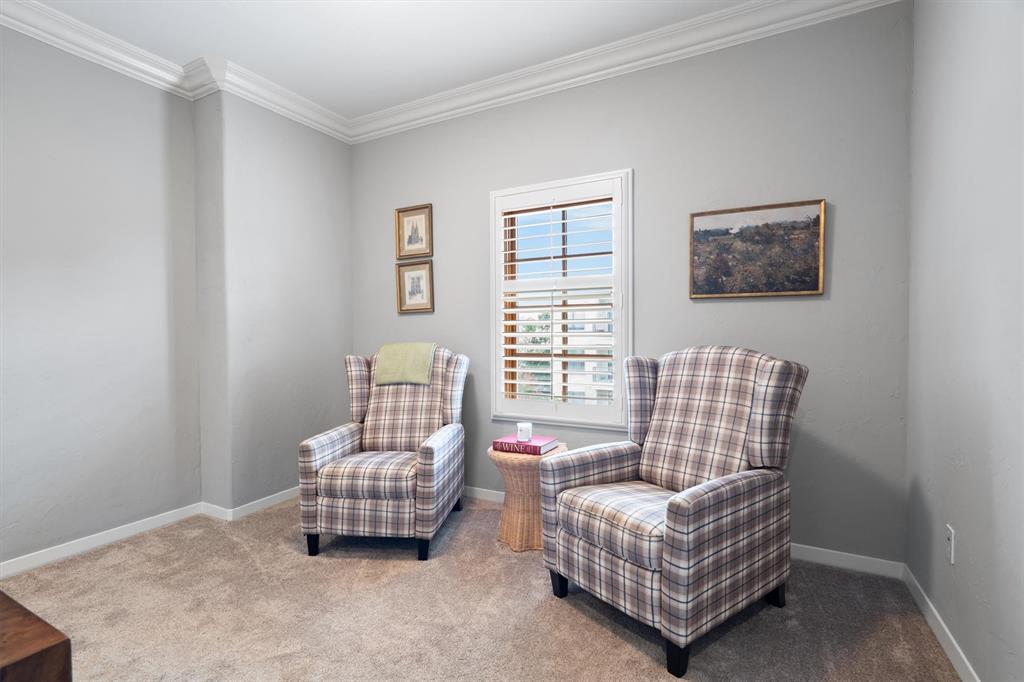 4323 Gilbert Avenue, Unit 4 Dallas, TX 75219 - Photo 29 of 40 a living room with furniture and a window