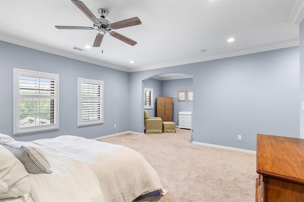 4323 Gilbert Avenue, Unit 4 Dallas, TX 75219 - Photo 33 of 40 a bedroom with a bed dresser and a window
