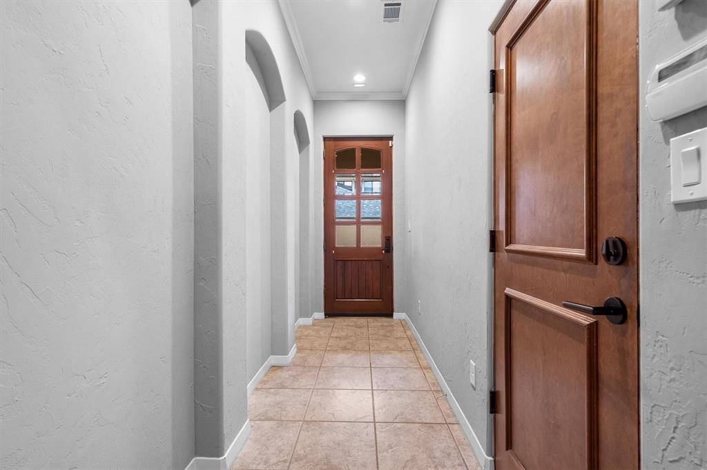 4323 Gilbert Avenue, Unit 4 Dallas, TX 75219 - Photo 7 of 40 a view of a hallway with wooden floor