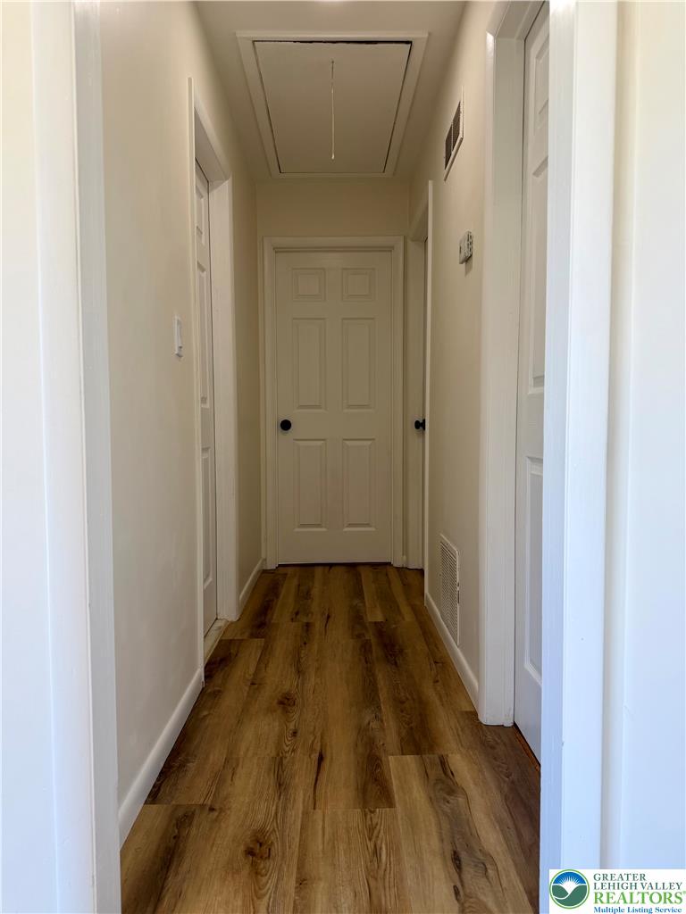 3508 Nazareth Road Easton, PA 18045 - Photo 18 of 25 Continuous new LVP floors and light-toned walls define this interior hallway.