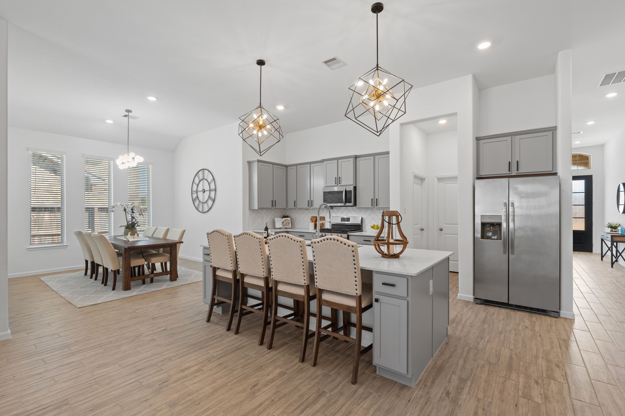 3612 Paloma Fls Lane Rosenberg, TX 77469 - Photo 18 of 49 a view of a dining room and livingroom with furniture wooden floor a chandelier