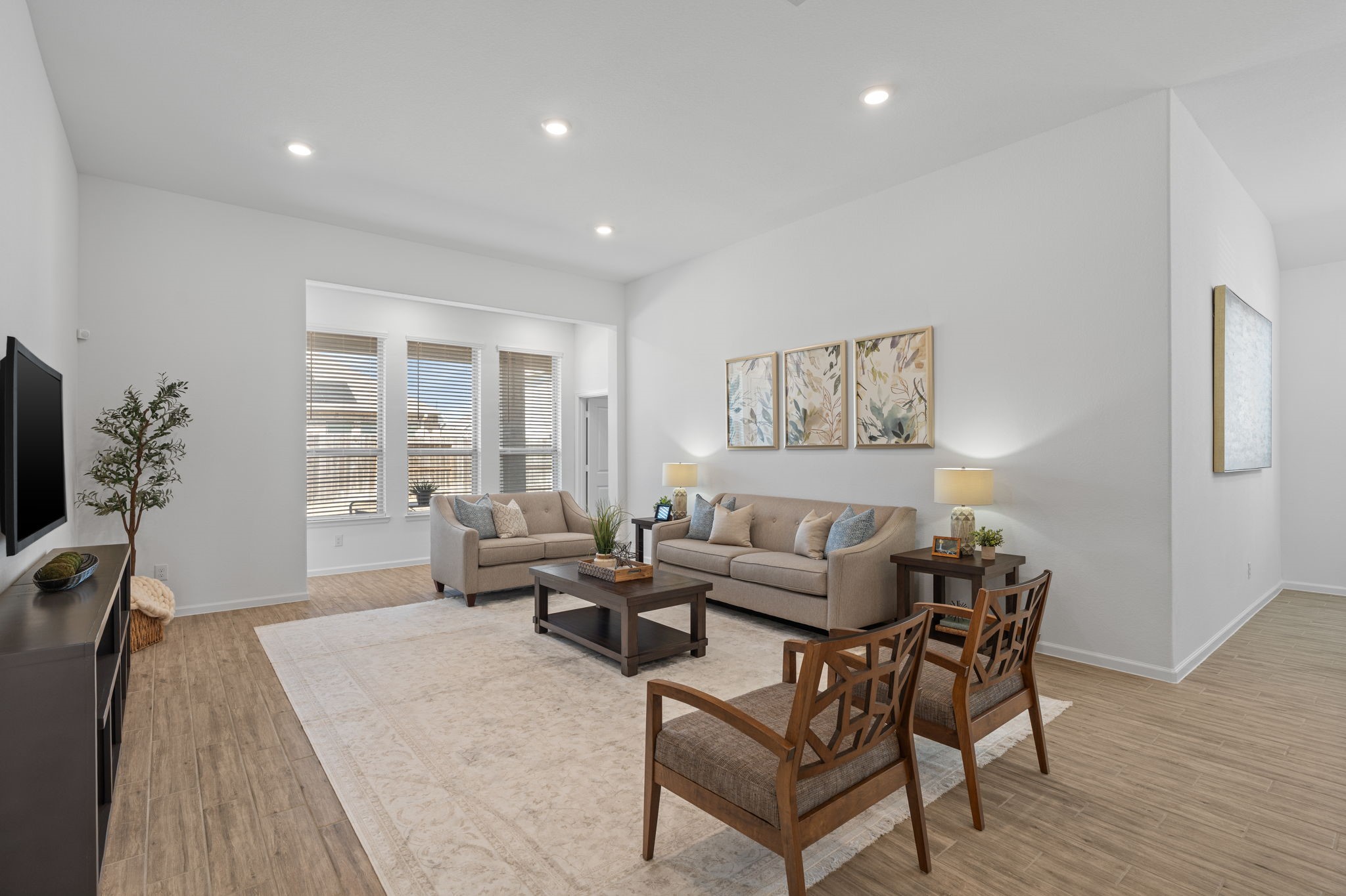 3612 Paloma Fls Lane Rosenberg, TX 77469 - Photo 25 of 49 a living room with furniture wooden floor and a flat screen tv