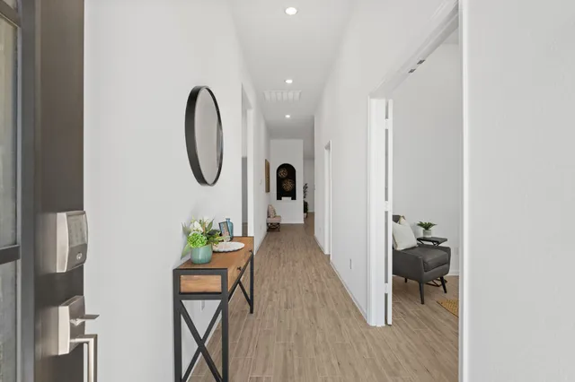 a view of a livingroom with furniture and lounge chair