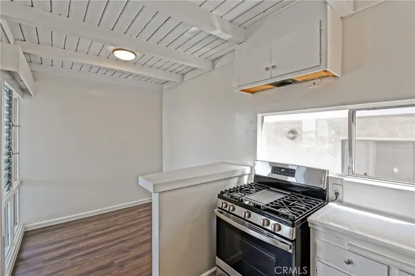 a kitchen with a stove and a microwave