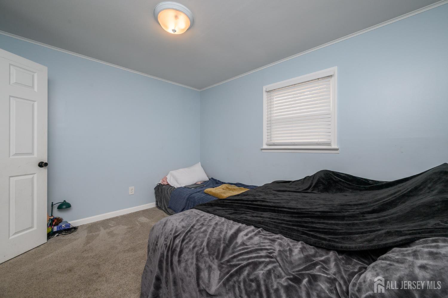 384 Cook Road Jackson, NJ 08527 - Photo 14 of 31 a bedroom with a bed and a window