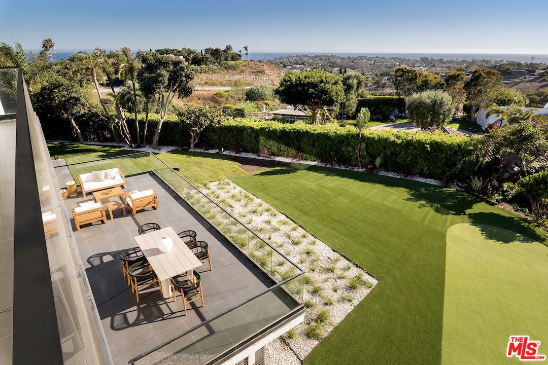 5931 Kanan Dume Road Malibu, CA 90265 - Photo 3 of 53 a view of a swimming pool with furniture