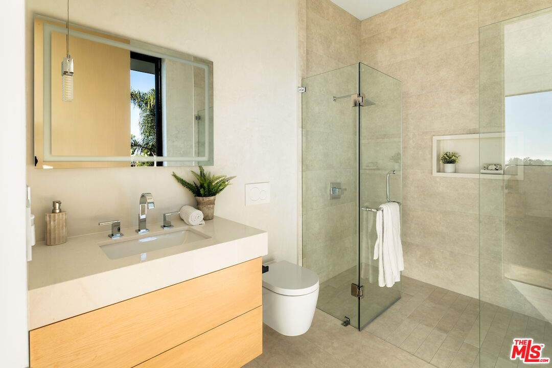 5931 Kanan Dume Road Malibu, CA 90265 - Photo 39 of 53 a bathroom with a sink and a mirror