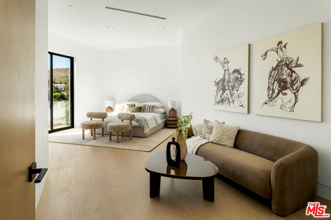 5931 Kanan Dume Road Malibu, CA 90265 - Photo 42 of 53 a living room with furniture and a white wall