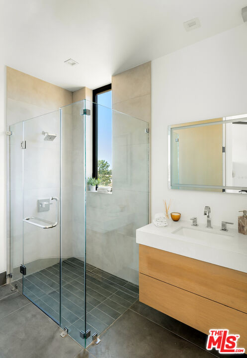 5931 Kanan Dume Road Malibu, CA 90265 - Photo 43 of 53 a bathroom with a sink and a mirror