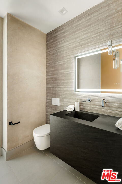 5931 Kanan Dume Road Malibu, CA 90265 - Photo 45 of 53 a bathroom with a sink and a mirror