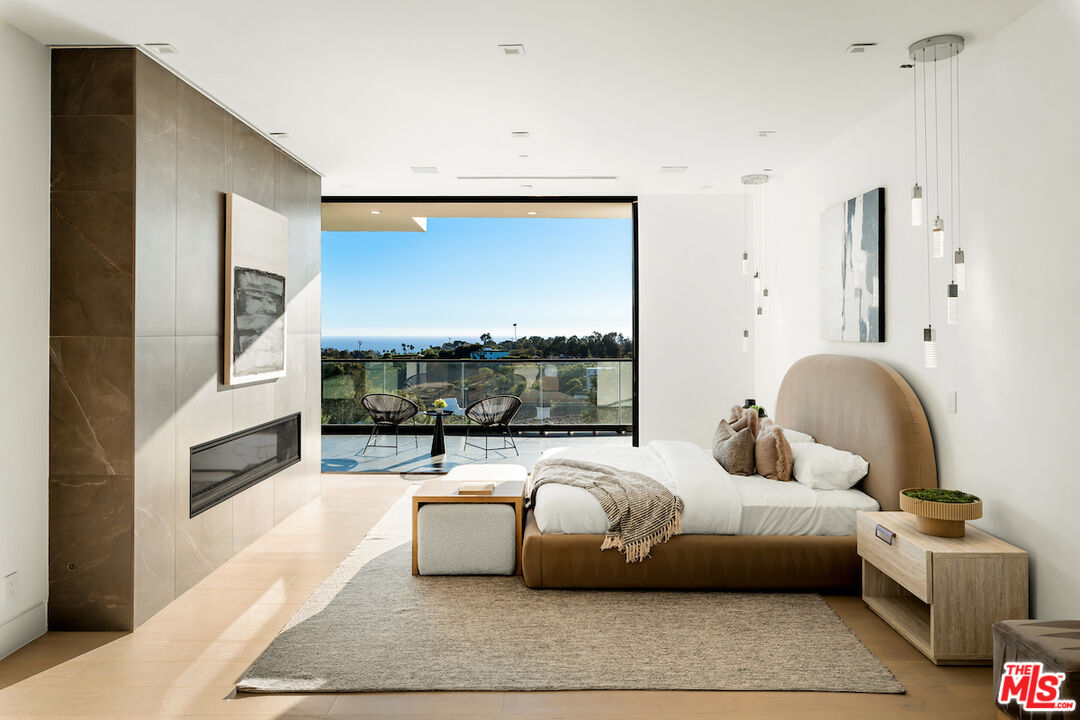 5931 Kanan Dume Road Malibu, CA 90265 - Photo 5 of 53 a living room with furniture fireplace and a flat screen tv