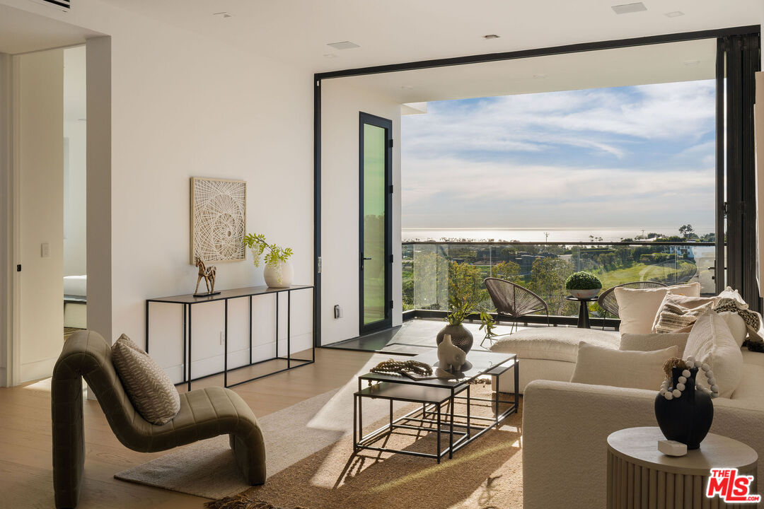 5931 Kanan Dume Road Malibu, CA 90265 - Photo 6 of 53 a living room with furniture and a large window