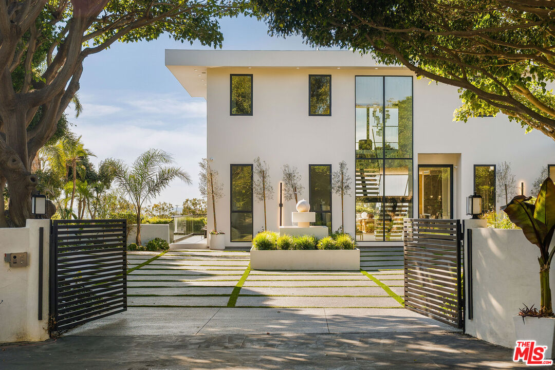 5931 Kanan Dume Road Malibu, CA 90265 - Photo 9 of 53 a front view of a house with a garden