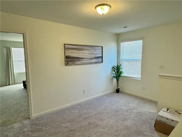 a view of an empty room with a window