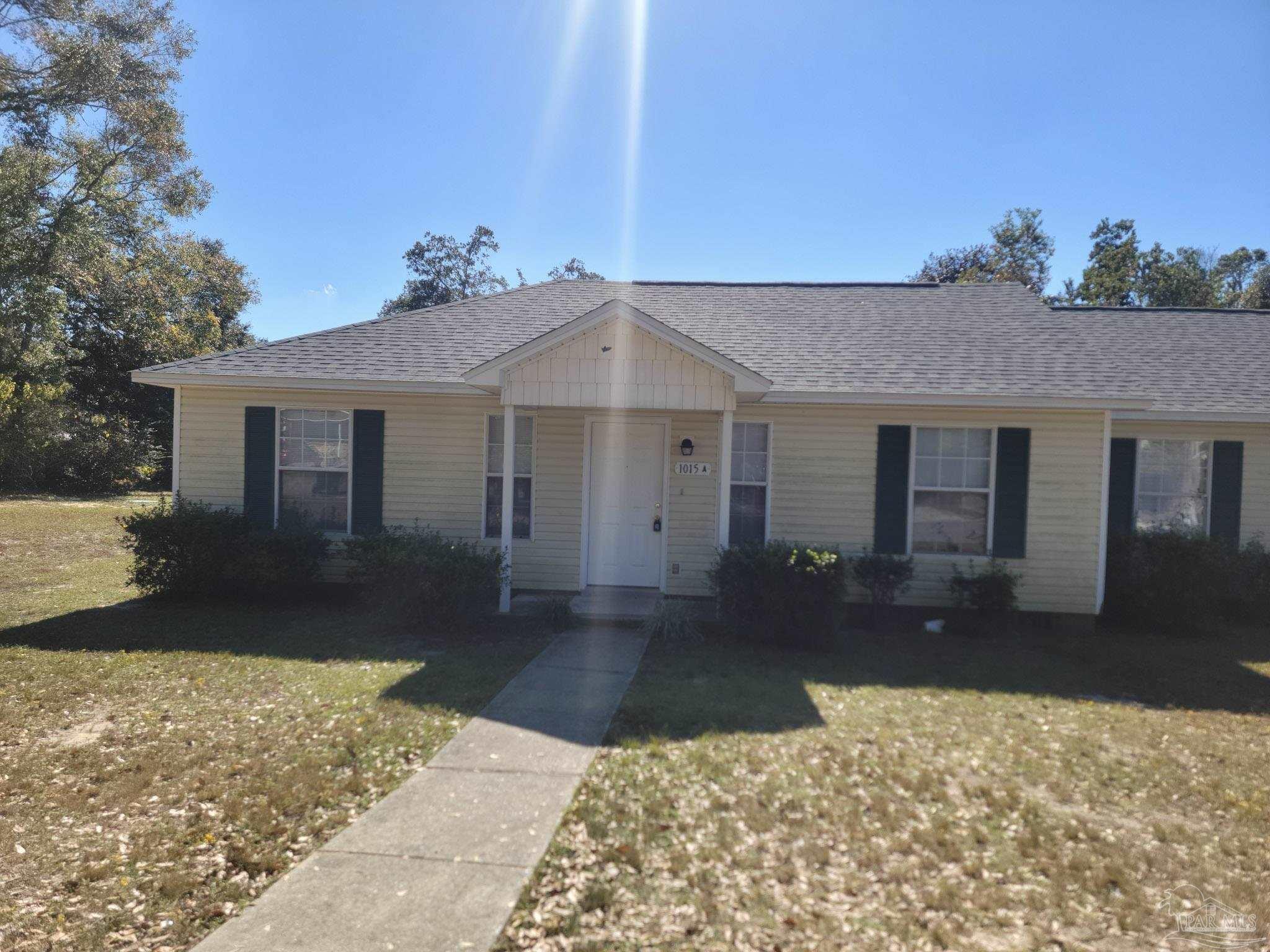 front view of a house with a yard