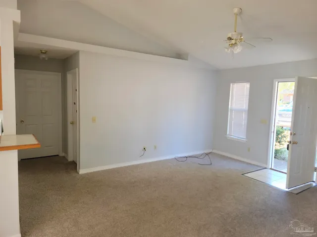 a view of an empty room with a window