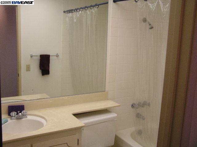 833 Ladera Court San Ramon, CA 94583 - Photo 4 of 9 a bathroom with a sink and a mirror