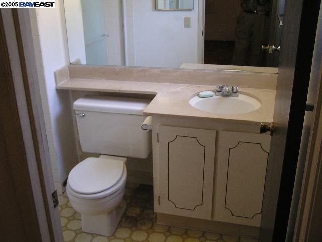 833 Ladera Court San Ramon, CA 94583 - Photo 8 of 9 a bathroom with a toilet sink and mirror