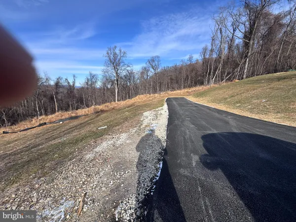 a view of a yard with a snow on the road