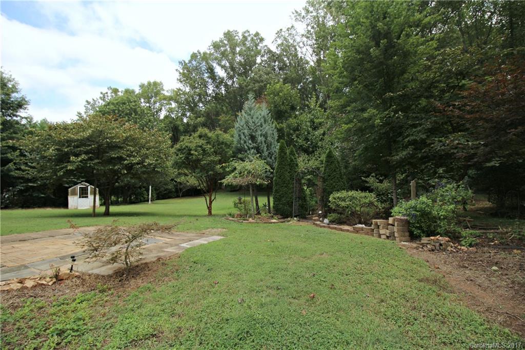 1130 Shue Road China Grove, NC 28023 - Photo 14 of 21 a big yard with lots of green space and trees