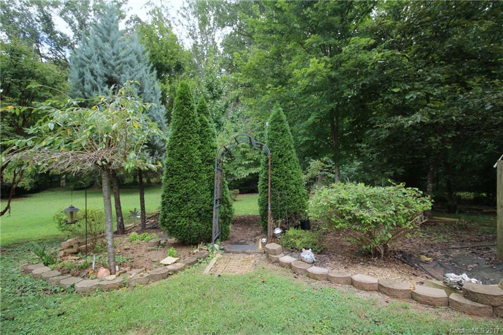 1130 Shue Road China Grove, NC 28023 - Photo 16 of 21 a view of a garden with a fountain