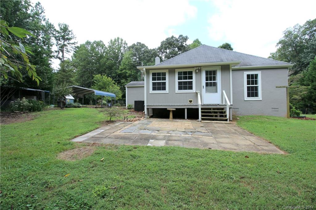 1130 Shue Road China Grove, NC 28023 - Photo 17 of 21 a front view of a house with a yard and trees