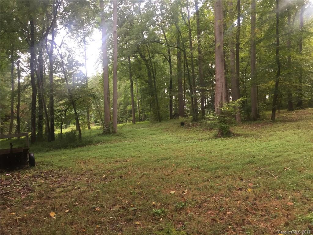 1130 Shue Road China Grove, NC 28023 - Photo 20 of 21 a view of a field with trees in the background