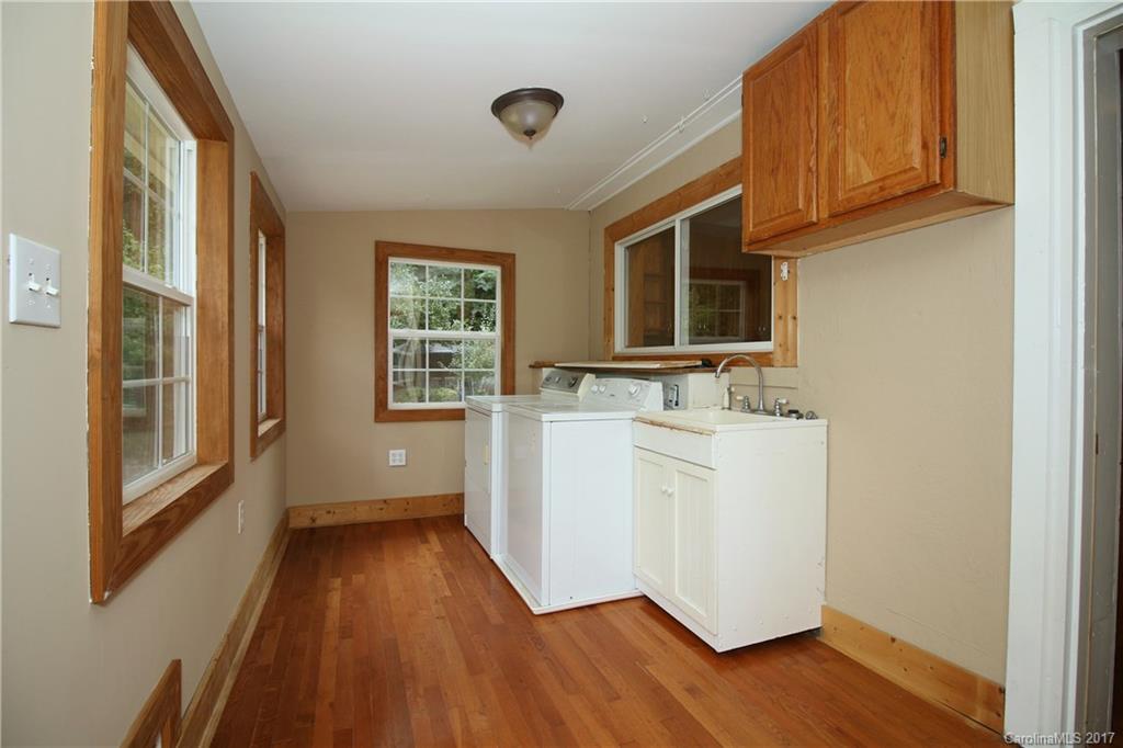 1130 Shue Road China Grove, NC 28023 - Photo 8 of 21 a view of a kitchen with wooden floor and electronic appliances