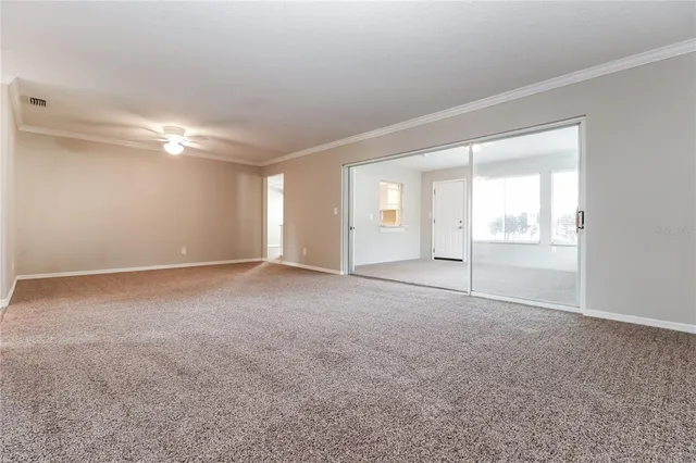 a view of an empty room with a window