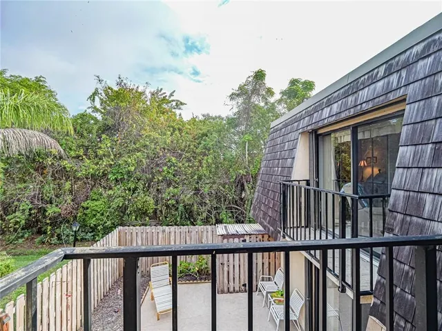 a view of balcony with yard