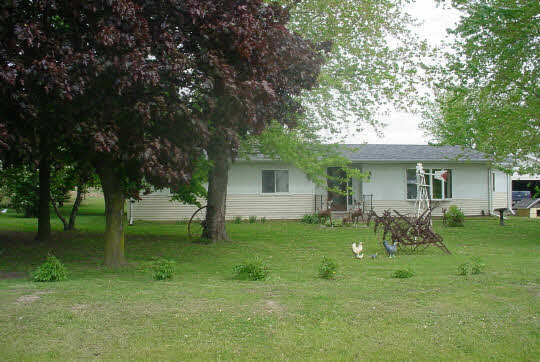 2364 West Pines Road Oregon, IL 61061 - Photo 1 of 8 a view of a house with a backyard