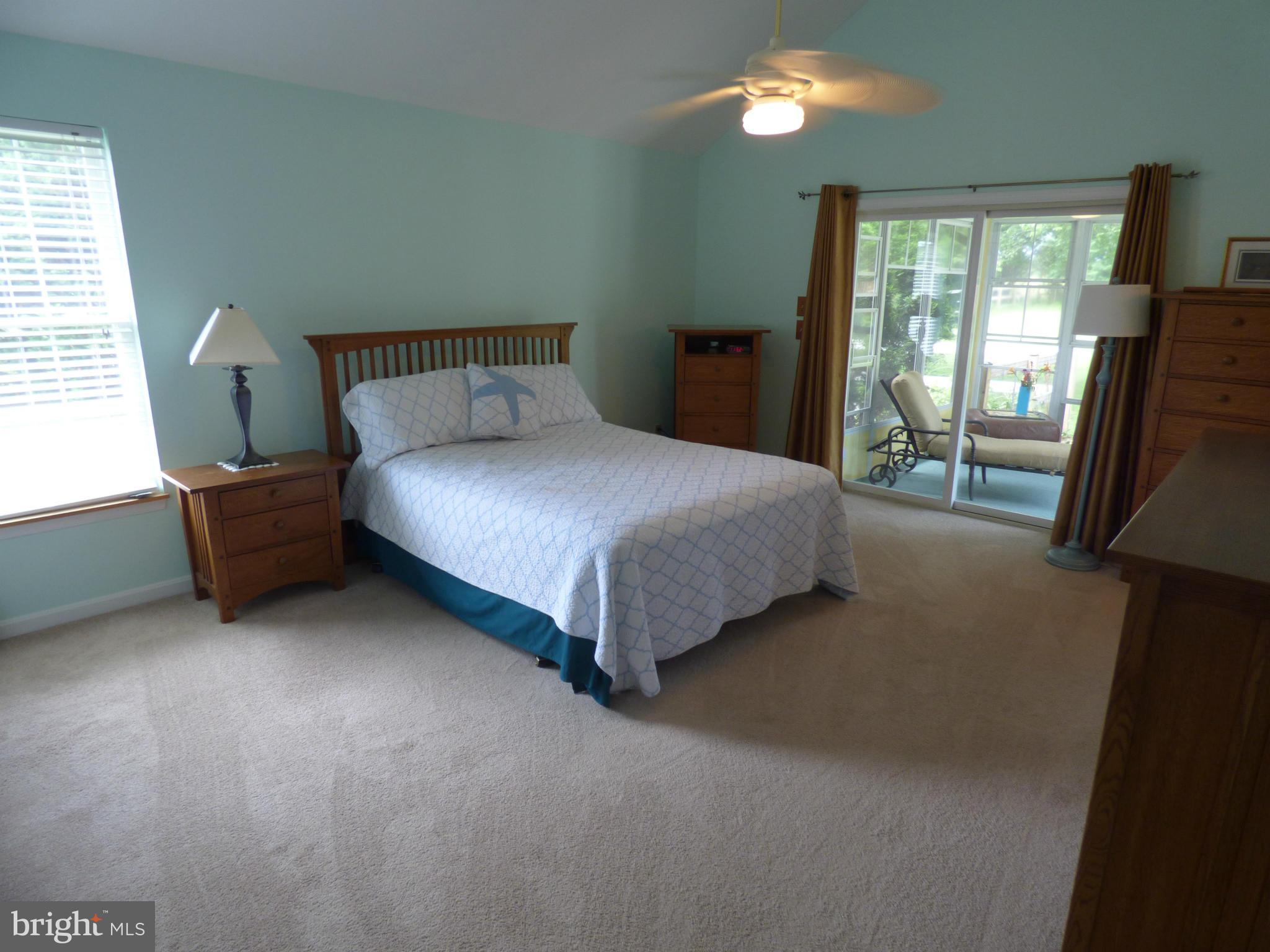 105 Myers Road Chestertown, MD 21620 - Photo 14 of 30 a bed sitting in a bedroom next to a window