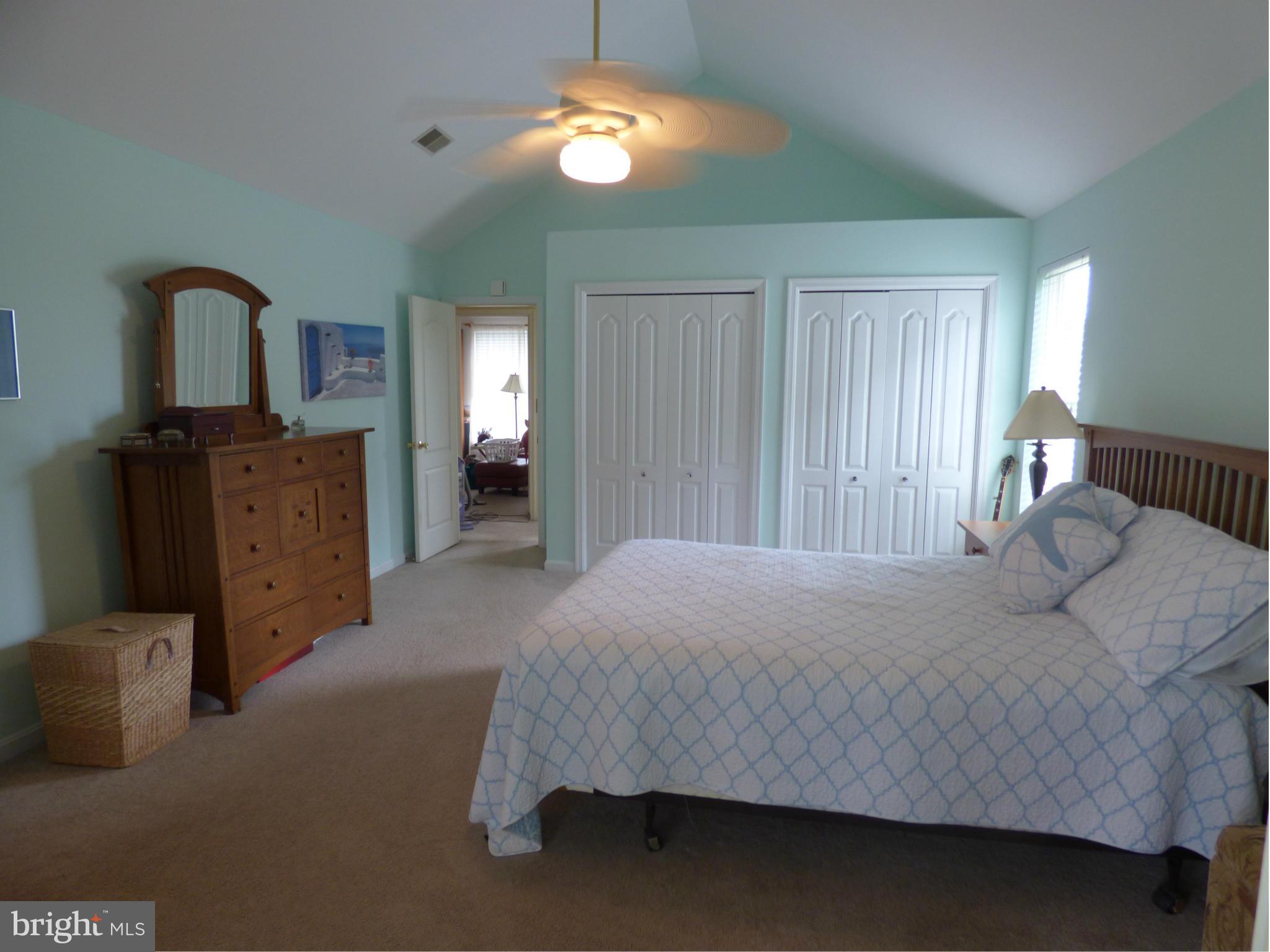 105 Myers Road Chestertown, MD 21620 - Photo 15 of 30 a bedroom with a bed and a chandelier