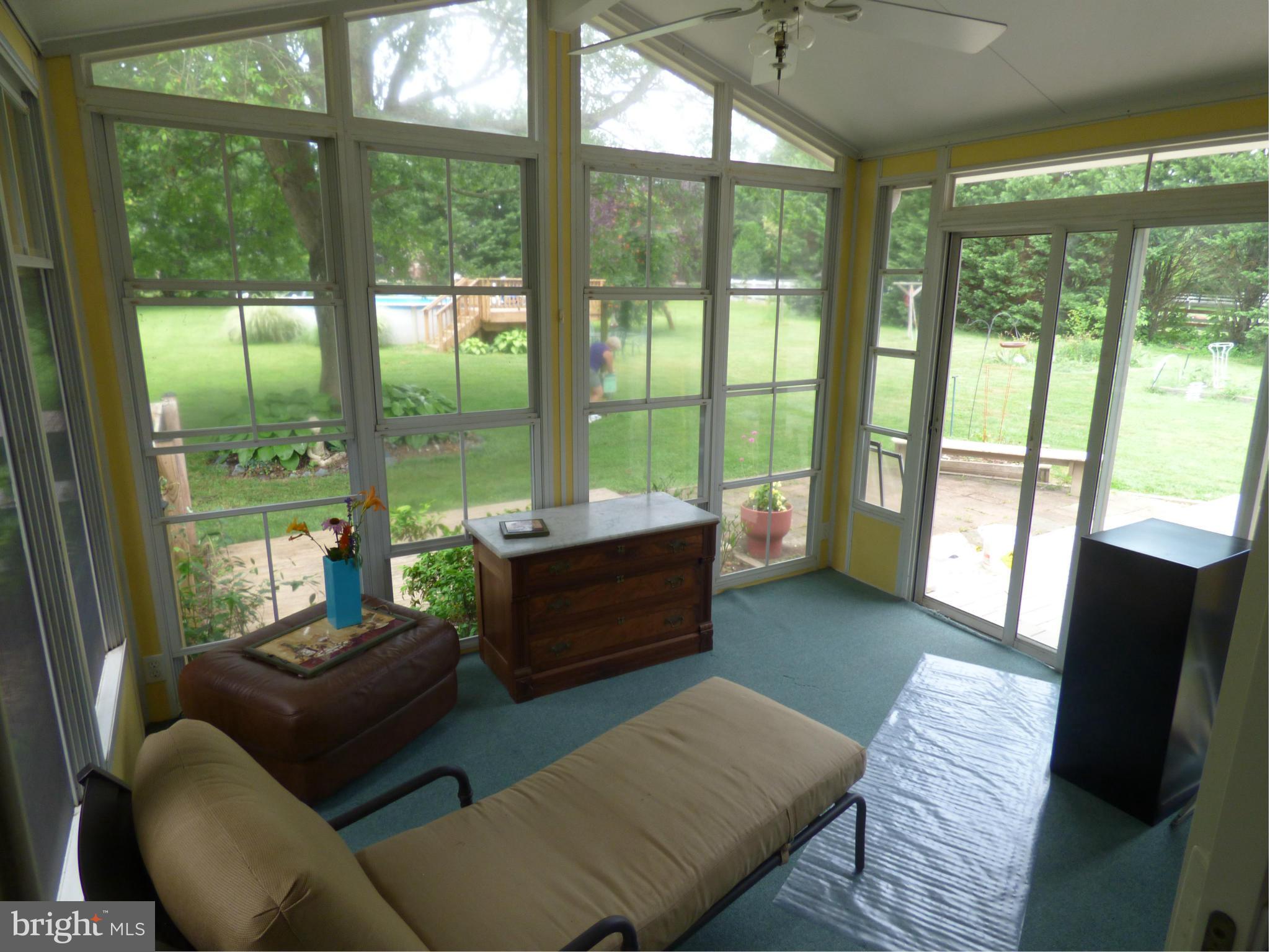 105 Myers Road Chestertown, MD 21620 - Photo 21 of 30 a living room with furniture and a large window with balcony view