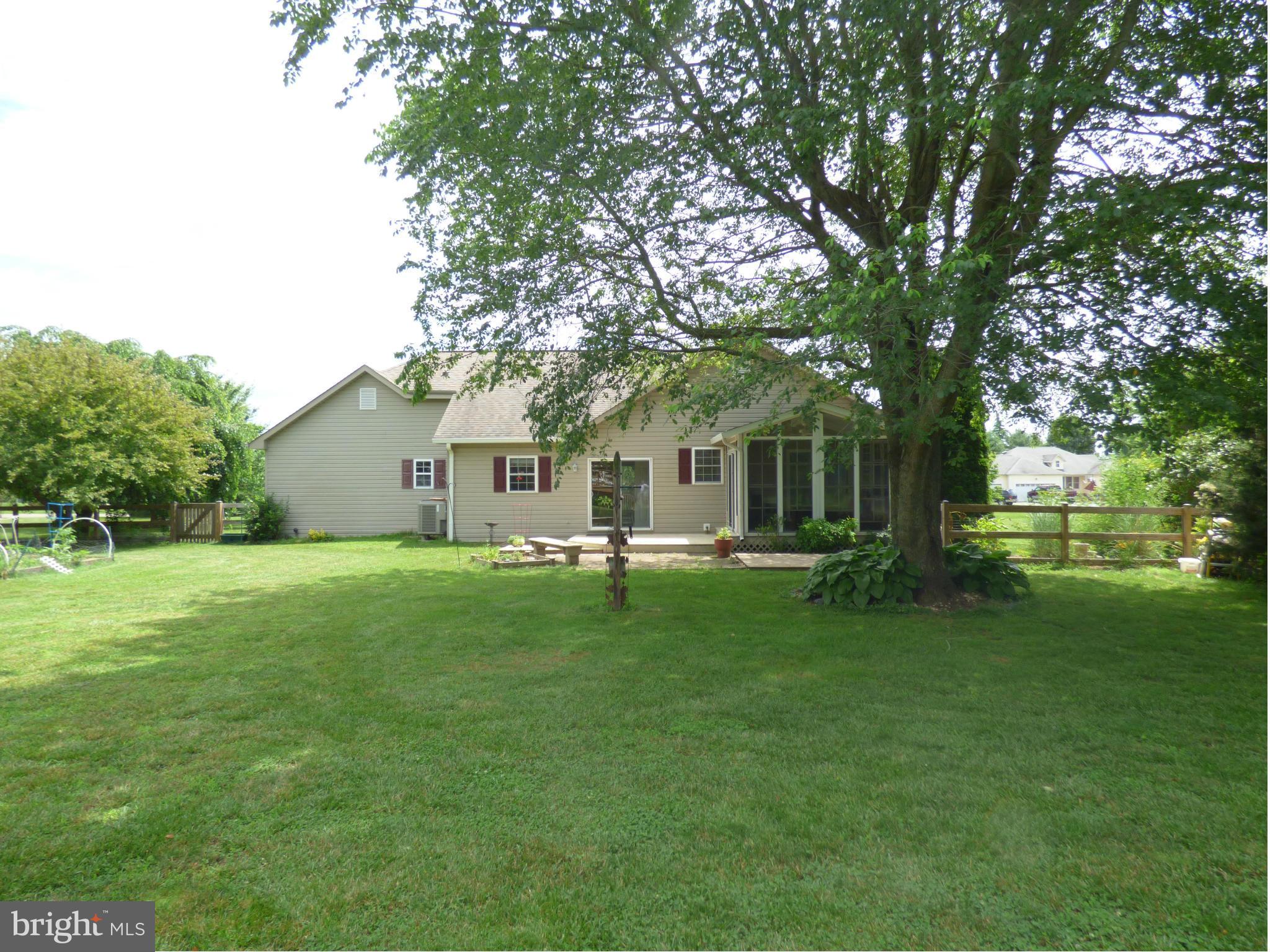 105 Myers Road Chestertown, MD 21620 - Photo 27 of 30 a front view of a house with a garden and trees