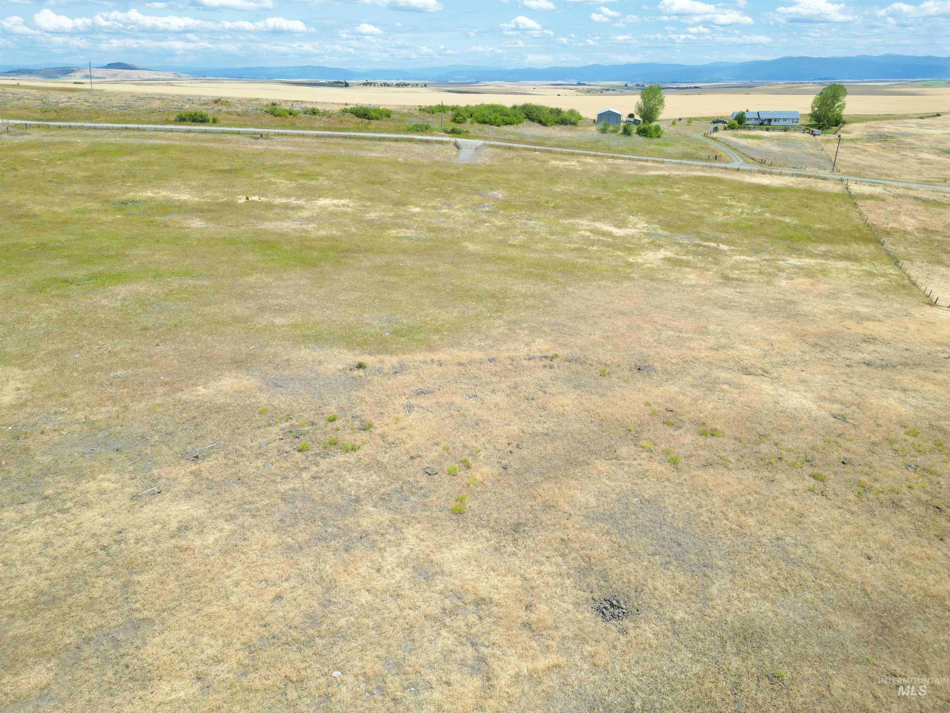 Tbd Wasem Road Cottonwood, ID 83522 - Photo 14 of 16 Aerial view of sparsely populated area featuring a mountain backdrop