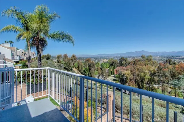 a view of a balcony with wooden fence