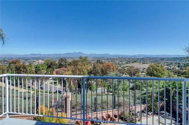 a view of a balcony with city view
