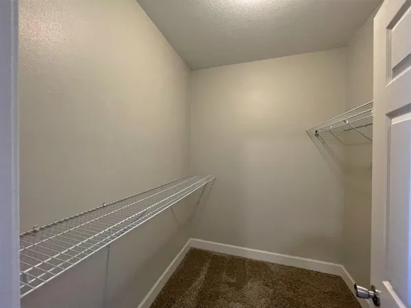 a view of small space with racks on the wall