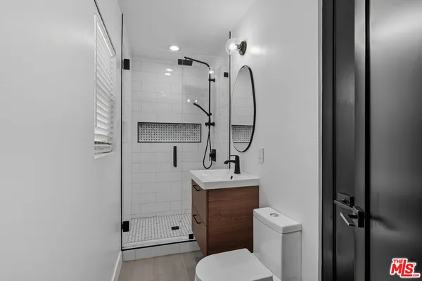 a view of a house with a backyard porch and sitting area