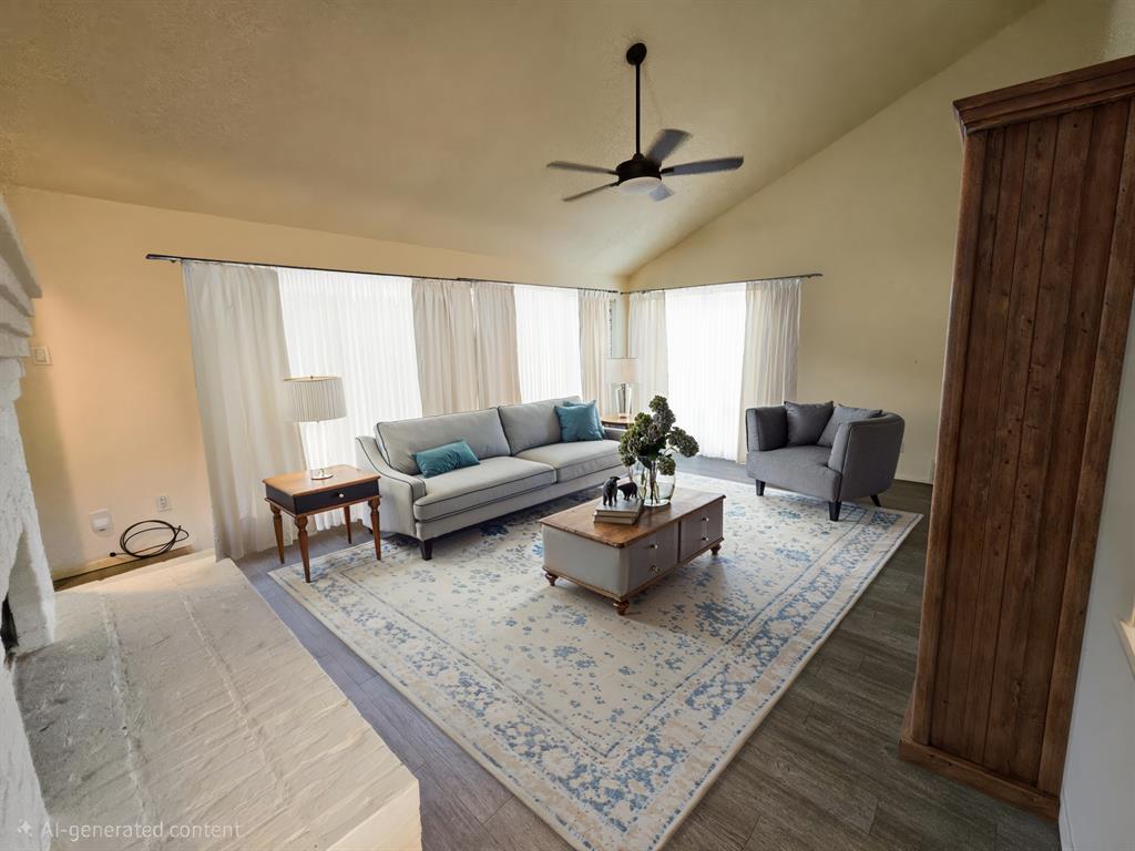 a living room with furniture and a rug