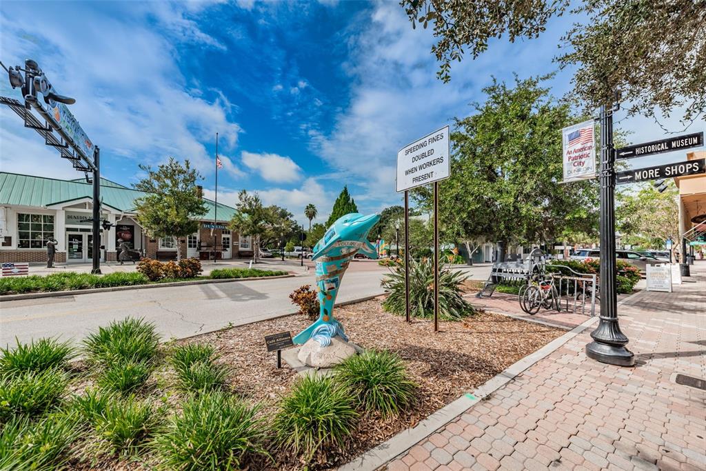 2476 Coronado Way Dunedin, FL 34698 - Photo 69 of 81 a view of a park with sitting area