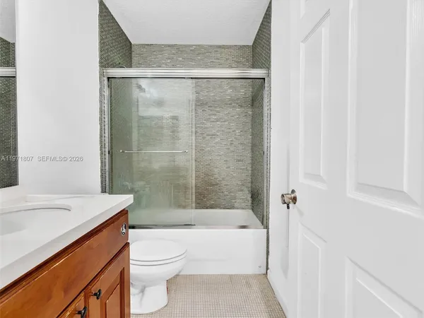 a bathroom with a sink a toilet and a bathtub