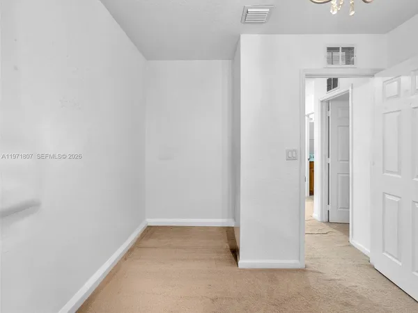 a view of a hallway with closet