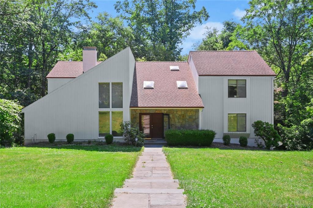 18 Ridge Brook Lane Stamford, CT 06903 - Photo 1 of 1 a front view of a house with garden