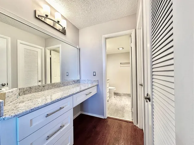 a close view of a utility room with dryer and washer